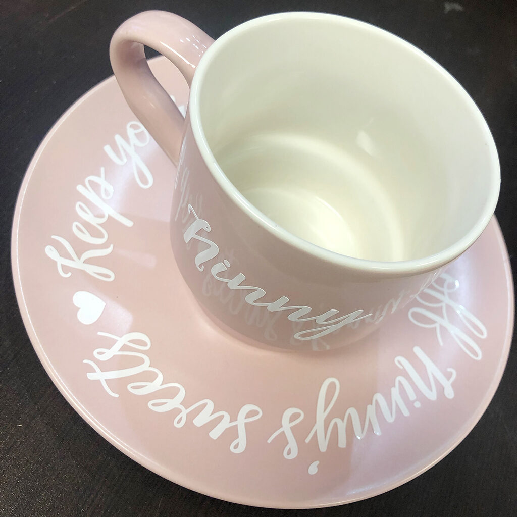pink teacup with vinyl lettering
